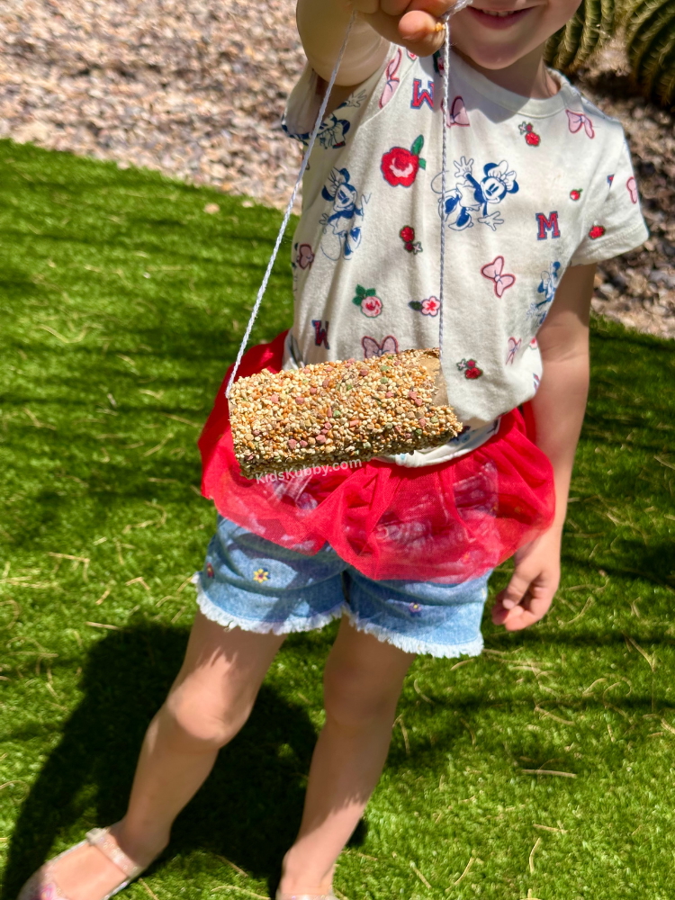 This is the best outdoor craft to make with kids in the spring and summer. Create a love of nature with these toilet paper roll bird feeders.