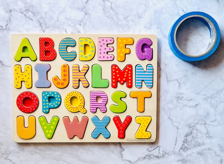 Preschool a home with this amazing learning game using puzzle pieces. This literacy activity works on letter sounds and fine motor skills. 