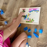 How to make a fun hunt and seek game for kids using puzzle pieces and tape.