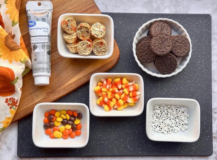 A simple Autumn recipe idea using Oreo cookies, mini peanut butter cups, candy corn, candy eyes, and Reece's Pieces. 
