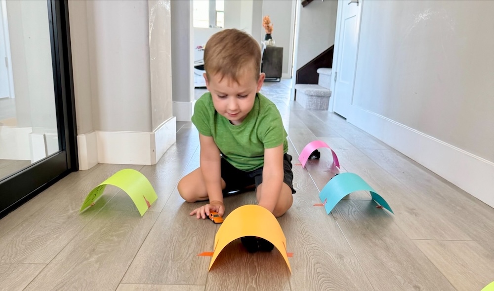 Set up an exciting toy car activity for kids using just paper and tape. Easy entertainment that lasts for hours.