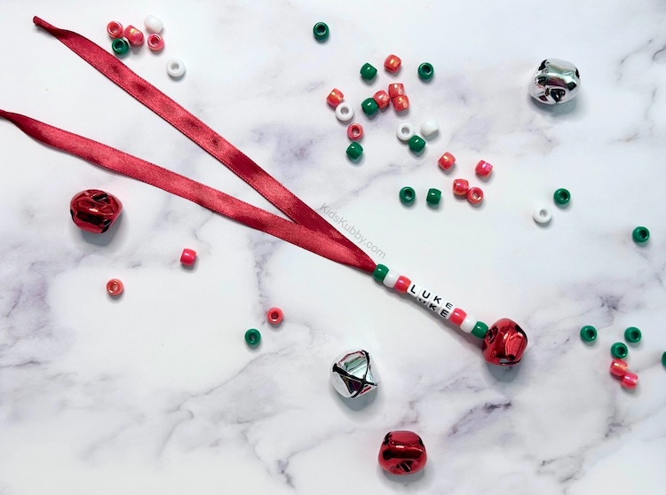 Grab some Christmas colored pony beads and letter beads to make the cutest homemade Christmas tree ornaments ever!