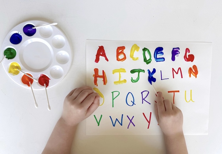 Let the little ones practice their handwriting skills with cotton swabs and paint!