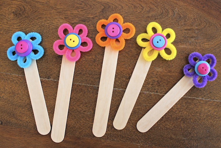 Spring flower bookmarks made with craft store popsicle sticks.