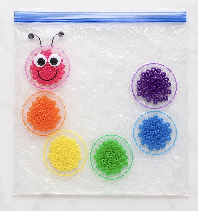 Sensory play and color recognition for kids using gel and a large plastic bag. 