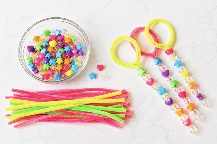 How to make your own bubble wands that actually work with pipe cleaners and beads.