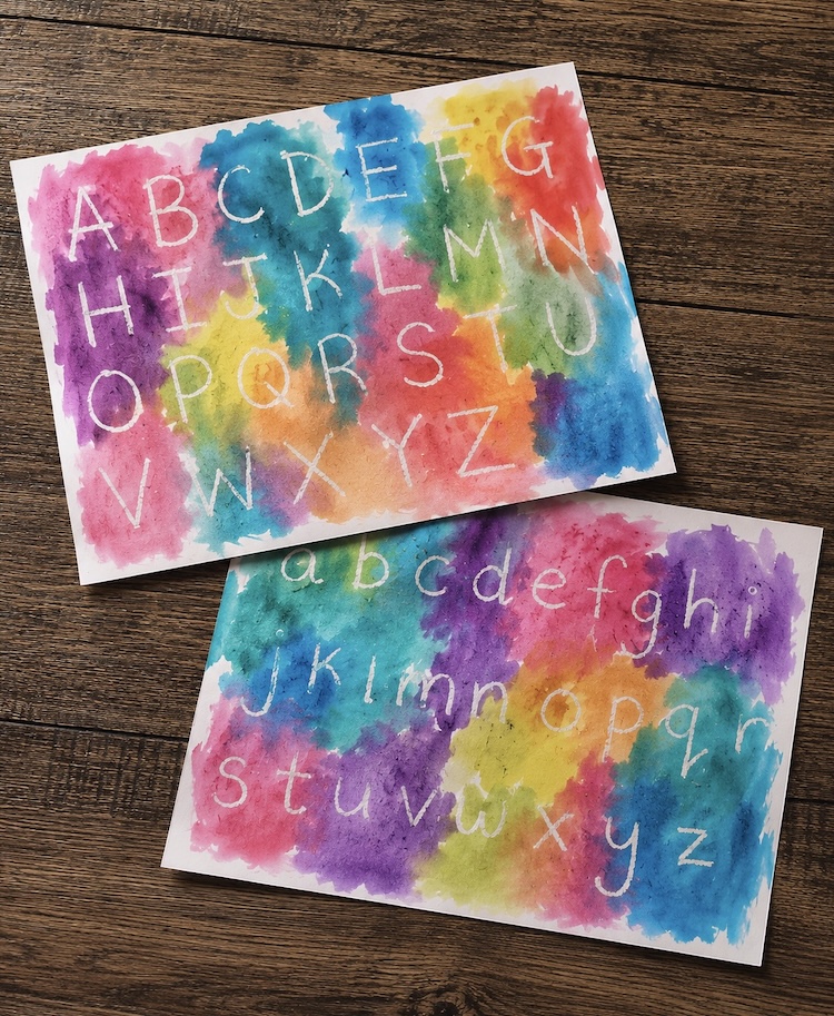 Magic watercolor activity for kids to learn their alphabet using a white crayon and paper. 
