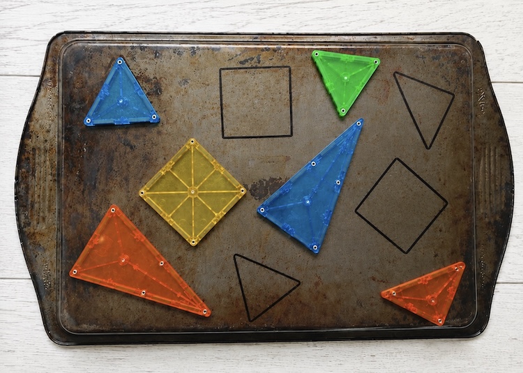 Metal sheet pan learning activity for kids using magnetic tiles. 