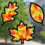 Step by Step Craft Tutorial: How to make fall leaf suncatchers with tissue paper and contact paper! A simple yet impressive Autumn craft to bring some color to your windows.