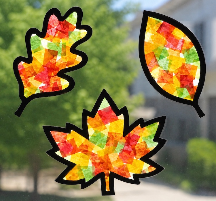 Step by Step Craft Tutorial: How to make fall leaf suncatchers with tissue paper and contact paper! A simple yet impressive Autumn craft to bring some color to your windows.