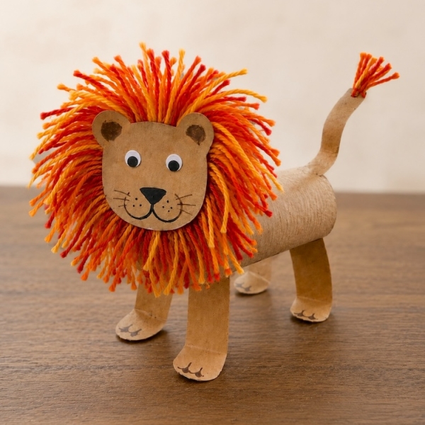 This adorable lion craft for kids is easy to make with cheap recycled toilet paper roll tubes and colorful yarn to make the impressive mane! It's a simple zoo animal craft for preschoolers and older kids. Full step by step tutorial included with lots of photos.