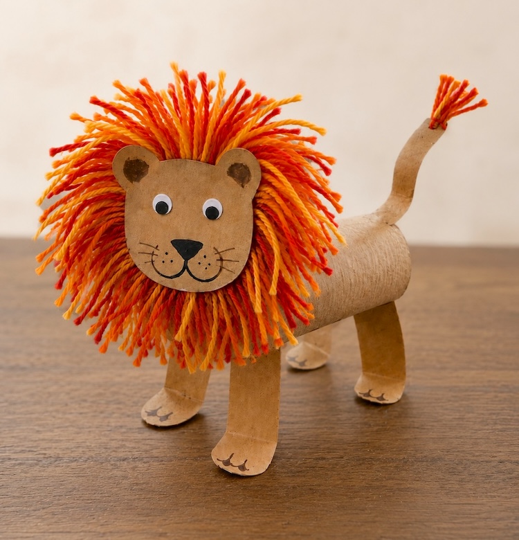This adorable lion craft for kids is easy to make with cheap recycled toilet paper roll tubes and colorful yarn to make the impressive mane! It's a simple zoo animal craft for preschoolers and older kids. Full step by step tutorial included with lots of photos.