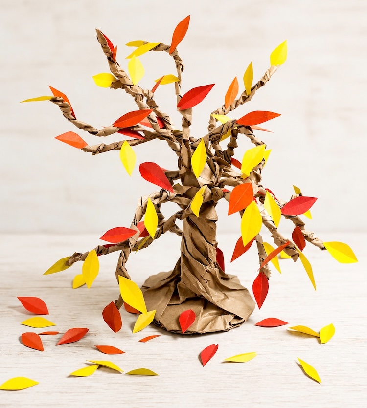How to make easy paper bag trees for fall using brown paper lunch bags and colorful construction paper. This simple kids craft includes a full step by step tutorial to make it really easy to follow along.