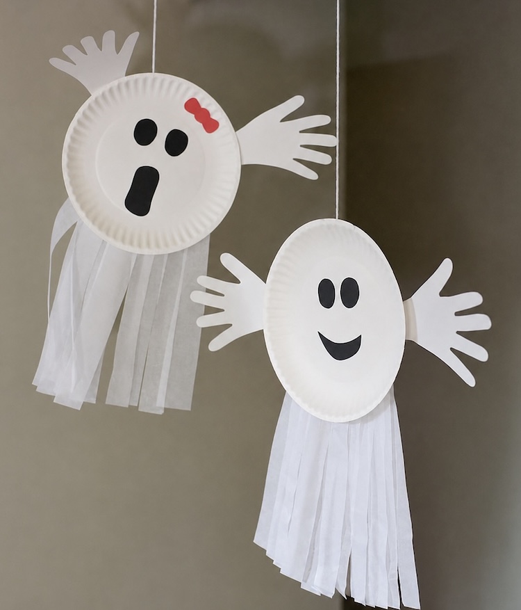 Spooky paper plate ghost craft for Halloween made with white streamers and construction paper for their cute faces. 