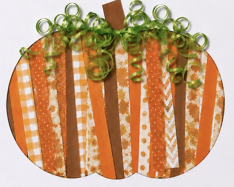 Simple paper strip craft for fall, how to make cute paper pumpkins with construction paper and ribbon. An easy Halloween or Thanksgiving art project for kids of all ages.