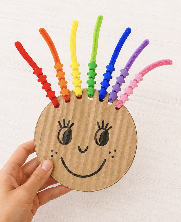 DIY Rainbow Hair Bead Activity to help toddlers and young kids with color recognition and fine motor skills while having fun!