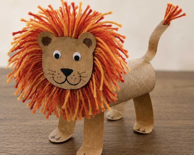 DIY Craft Tutorial: How to make adorable toilet paper roll lions with a fuzzy yarn mane and googly eyes. A fun animal craft for kids of all ages! So simple and yet impressive.
