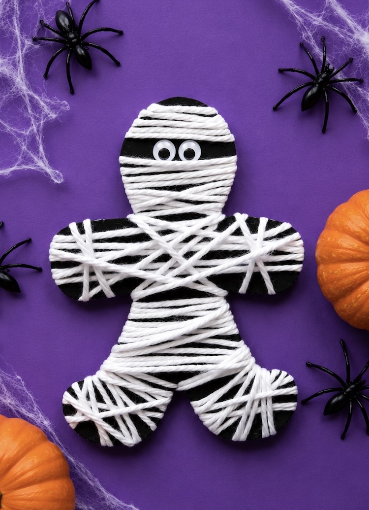 Spooky mummy craft for kids made with cheap recycled materials from home.