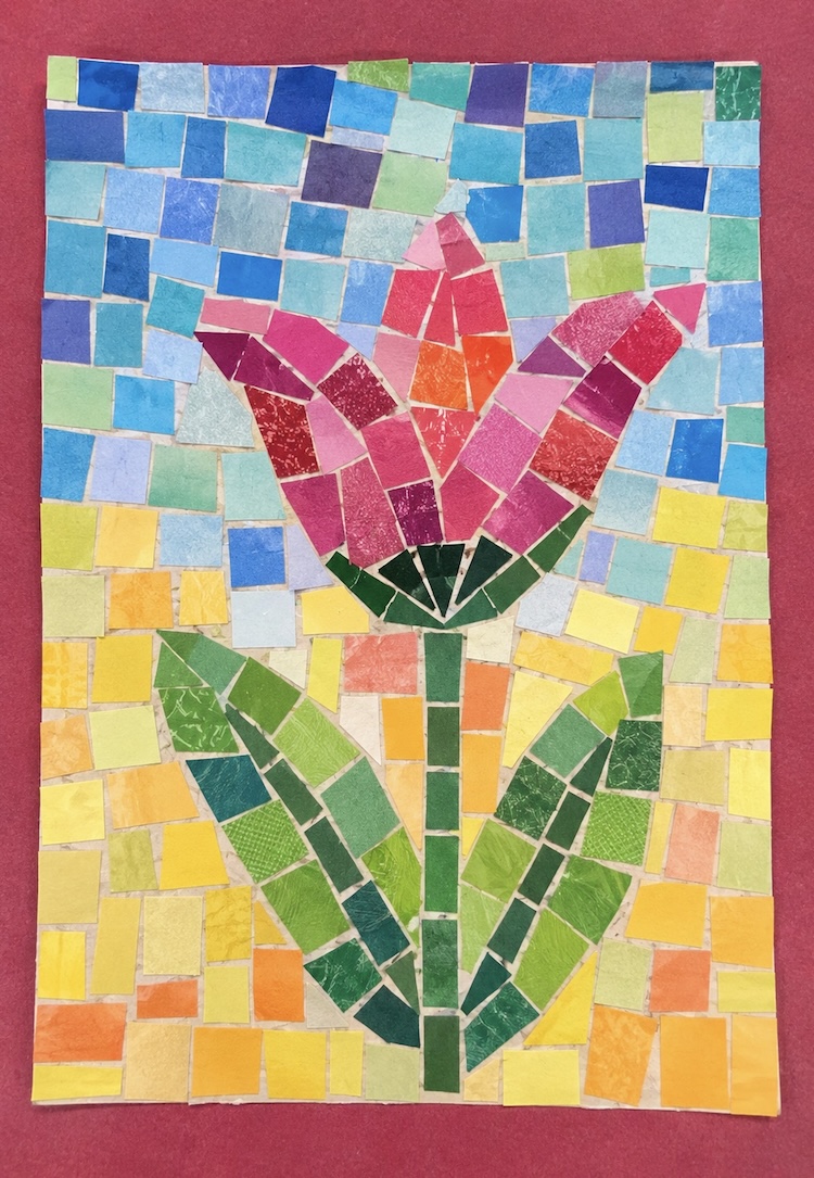 Mosaic style art using torn pieces of paper and glue.