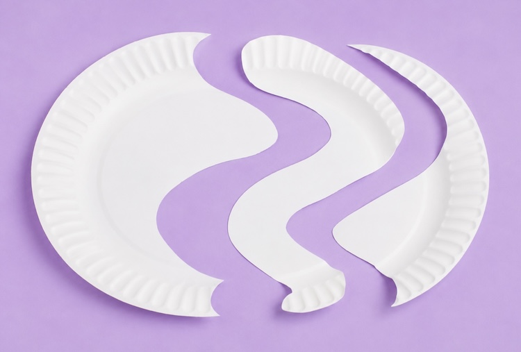 How to cut a paper plate for making a craft caterpillar project for kids.