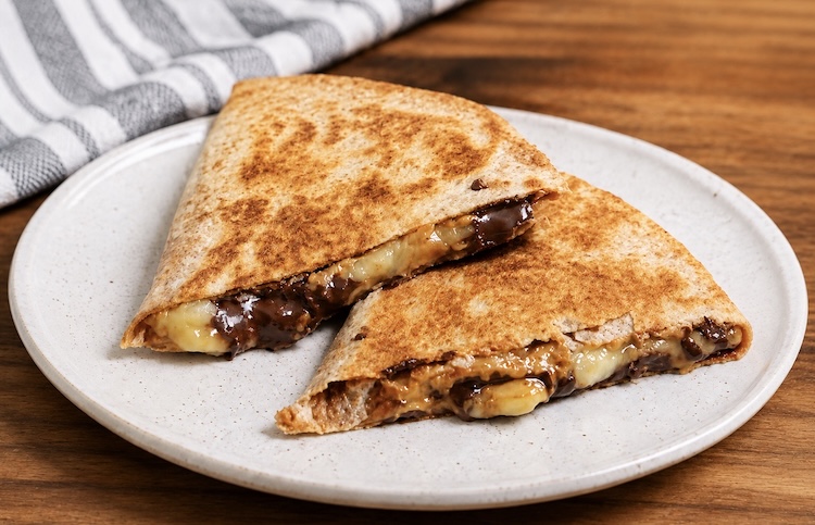 How to make sweet quesadillas for breakfast or lunch with peanut butter, bananas, chocolate chips, and tortillas.