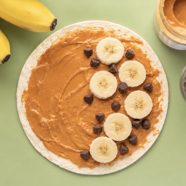 How to make a fun snack, breakfast or quick lunch for kids with tortillas, peanut butter, banana, and chocolate chips. A fun sweet twist on quesadillas!