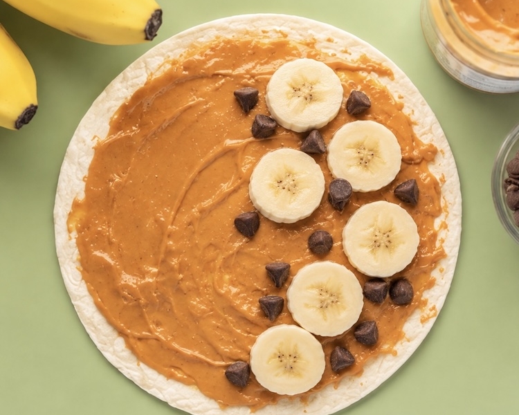 How to make a fun snack, breakfast or quick lunch for kids with tortillas, peanut butter, banana, and chocolate chips. A fun sweet twist on quesadillas!