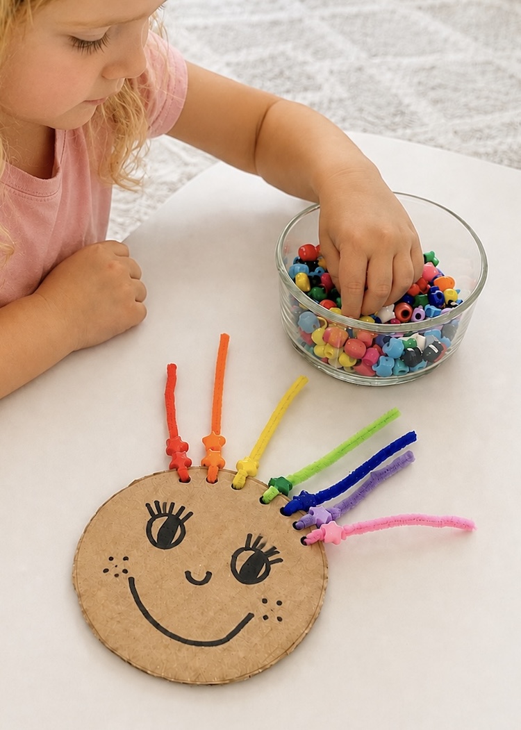 Easy, low prep, learning activities for young toddlers made with cheap cardboard, pony beads, and colorful fuzzy pipe cleaners.