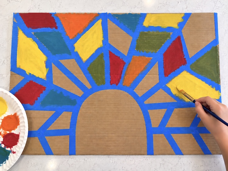 Painting a colorful turkey for thanksgiving using a creative tape resistant technique. 