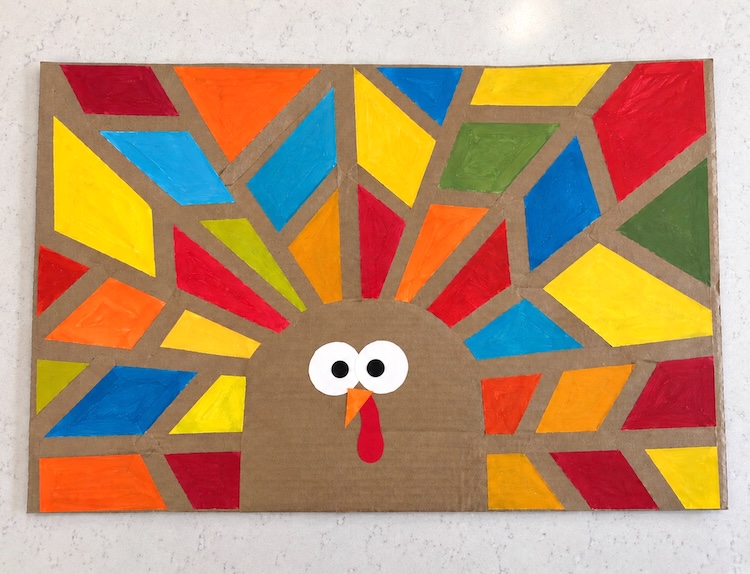How to make tape resistant turkey art! A fun, easy, and budget friendly fall craft for kids of all ages using cardboard and painter's tape. 
