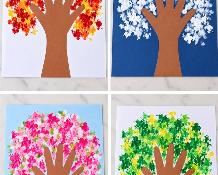 Easy construction paper tree art kids craft using q-tips as paint brushes and a traced hand as the tree trunk. This simple low mess craft is made with cheap supplies and is fun for kids of all ages.