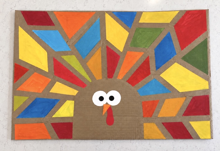 Tape resistant turkey art for kids! A cheap and easy recycled craft project for Thanksgiving.