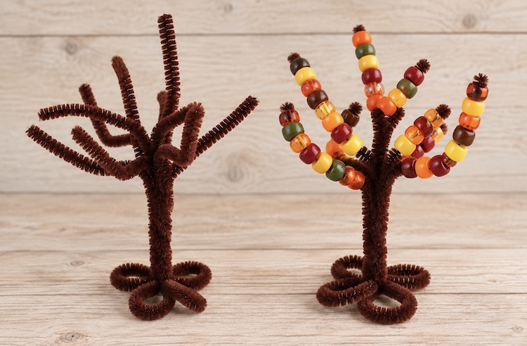 How to make an easy pipe cleaner tree trunk with branches for preschoolers and toddlers to lace pony beads onto, a fun craft and fine motor activity for children.