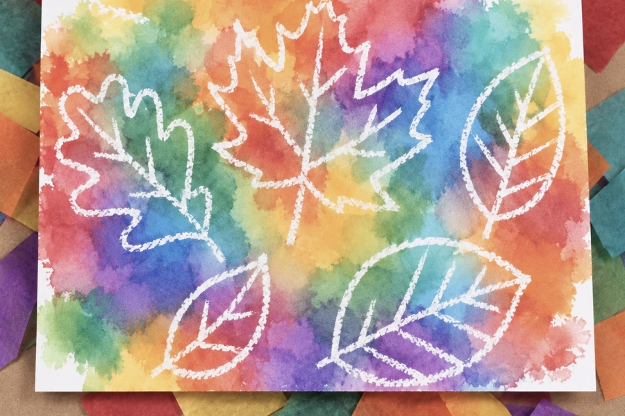 Color transfer art using bleeding tissue paper and white cardstock. An easy craft project for kids to make using a water bottle and white crayon to make leaf or flower designs.