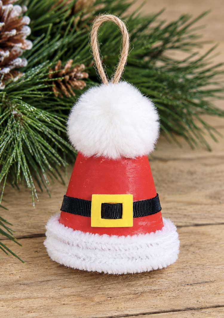 Cute DIY Santa Hat Christmas Ornament. This easy holiday craft is fun to make at home with the entire family using mini clay pots, paint, and fluffy pipe cleaners! 