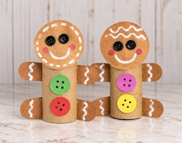 Step six gluing everything together to reveal an adorable gingerbread man craft for Christmas made out of cheap recycled materials including toilet paper rolls.