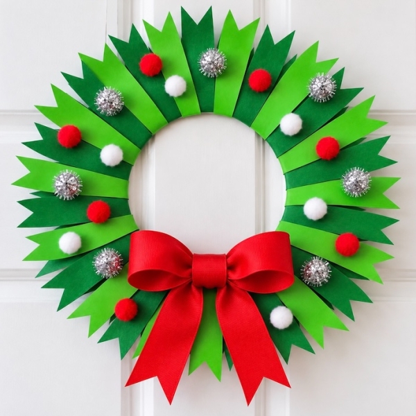 How to make a beautiful paper plate Christmas tree craft with a full tutorial and step by step instructions. A cheap and simple holiday project to make at home with the kids.