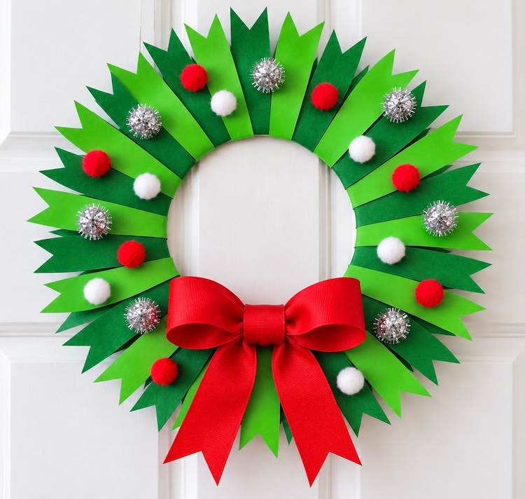 How to make a beautiful paper plate Christmas tree craft with a full tutorial and step by step instructions. A cheap and simple holiday project to make at home with the kids.
