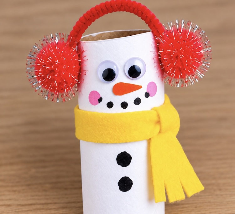 Cute and easy snowman craft for Christmas made with a toilet paper roll that has been painted white.