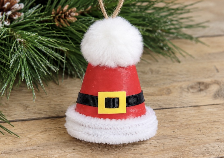 How to make an easy Santa Hat ornament for Christmas using a mini clay pot, pipe cleaners, and a white Pom Pom.