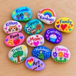 Fun DIY painted rocks using acrylic markers! This low mess craft is not only fun and cheap for kids of all ages to make, but it teaches them gratitude and the importance of remembering the things we are grateful for.