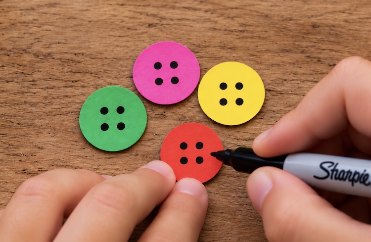 Step five making the cute and colorful buttons out of construction paper.