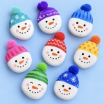 Cute DIY Snowman Rocks made with just paint, acrylic or paint markers, and a fuzzy pom-pom for its adorable hat. An easy and cheap holiday craft for kids to make!