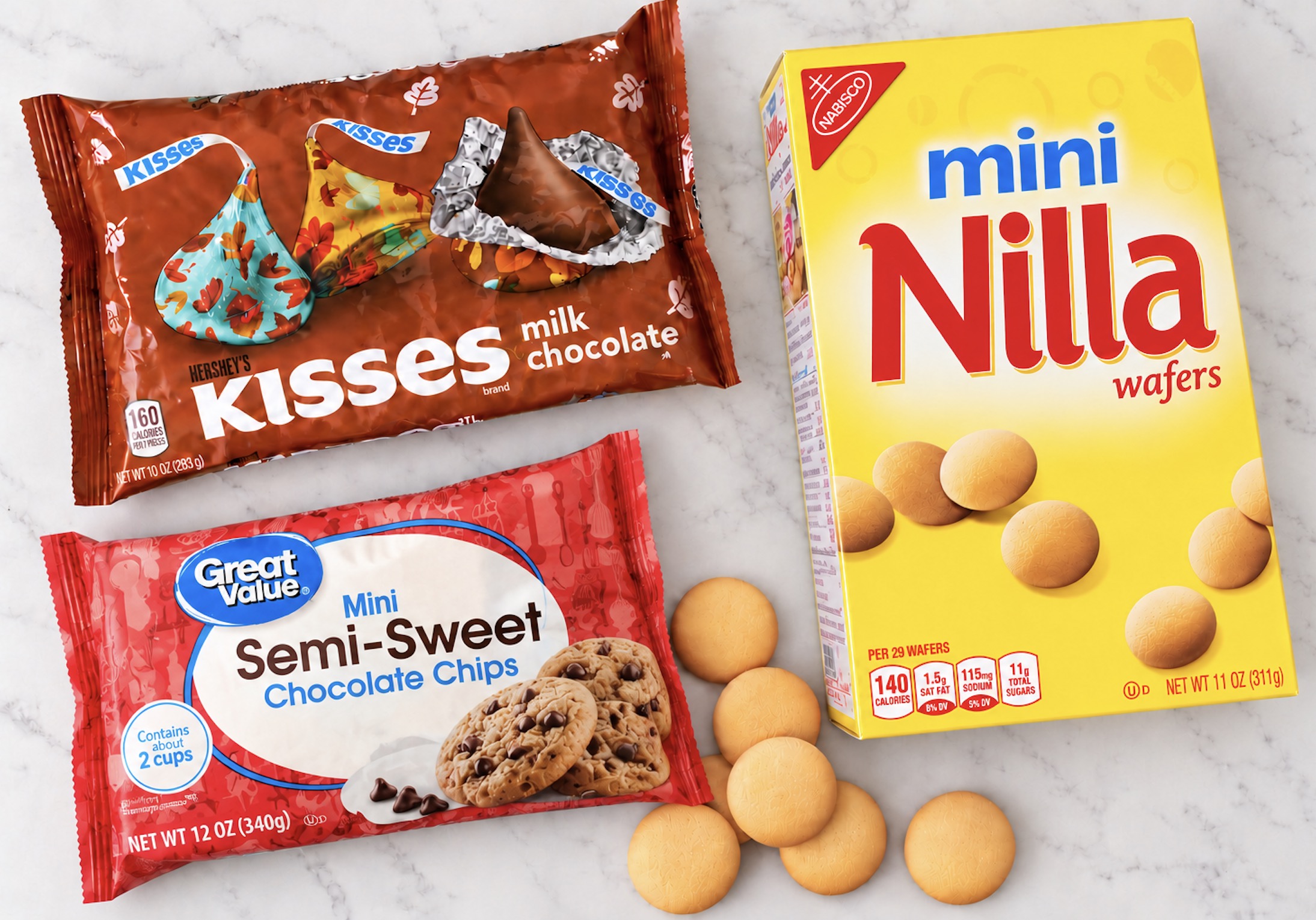 Box of Nilla wafers, bag of Hershey's kisses, and bag of mini chocolate chips for making 3 ingredient chocolate acorn treats.