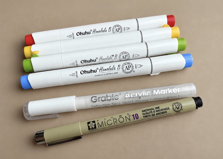 Ohuhu Alcohol Markers and other pens. 