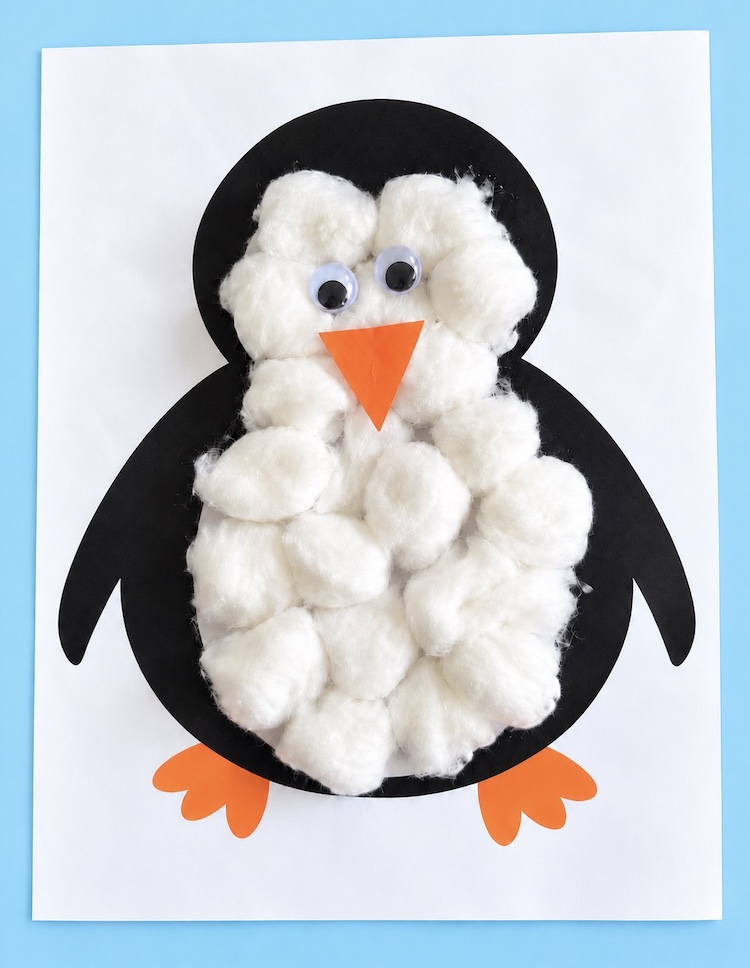Simple, low mess penguin winter craft for little kids using a free printable penguin picture and cotton balls to decorate. Let the kids glue them on one by one for a rainy day project preschoolers will love.