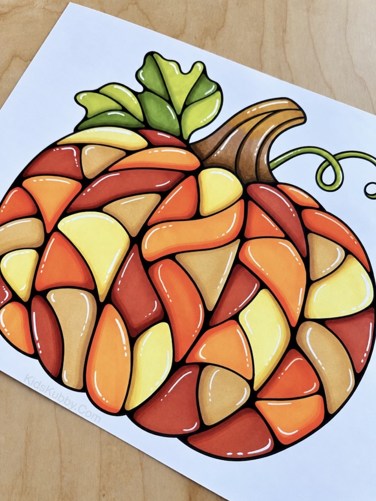 How to make a coloring page look like stained glass. A simple fall art project and DIY tutorial with a free printable pumpkin coloring page.
