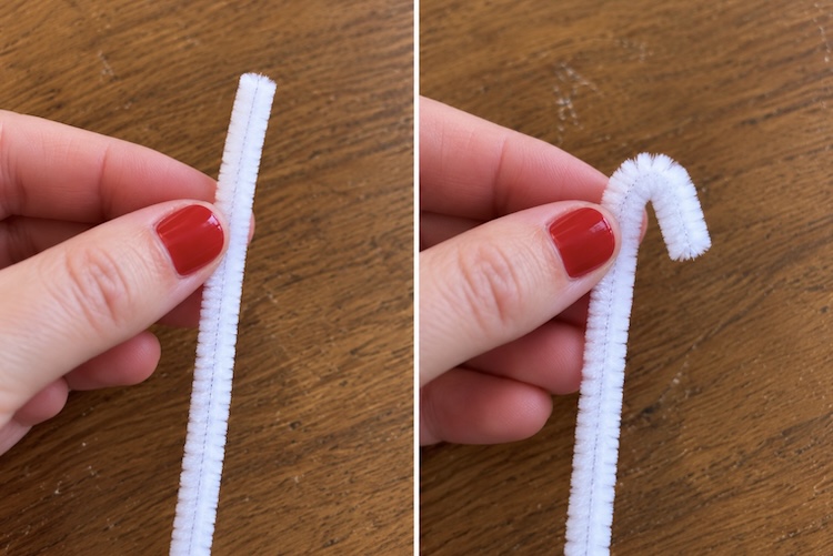 Step one of making DIY candy cane ornaments. Bending the pipe cleaner on the end so that the beads don't fall off.